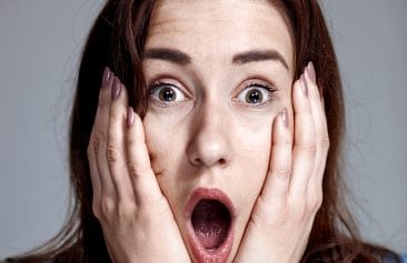 Young woman with shocked facial expression